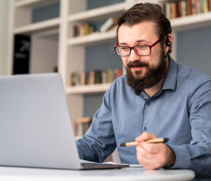 man watching engineer workshop webinar on laptop