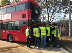 Standing outside a bus